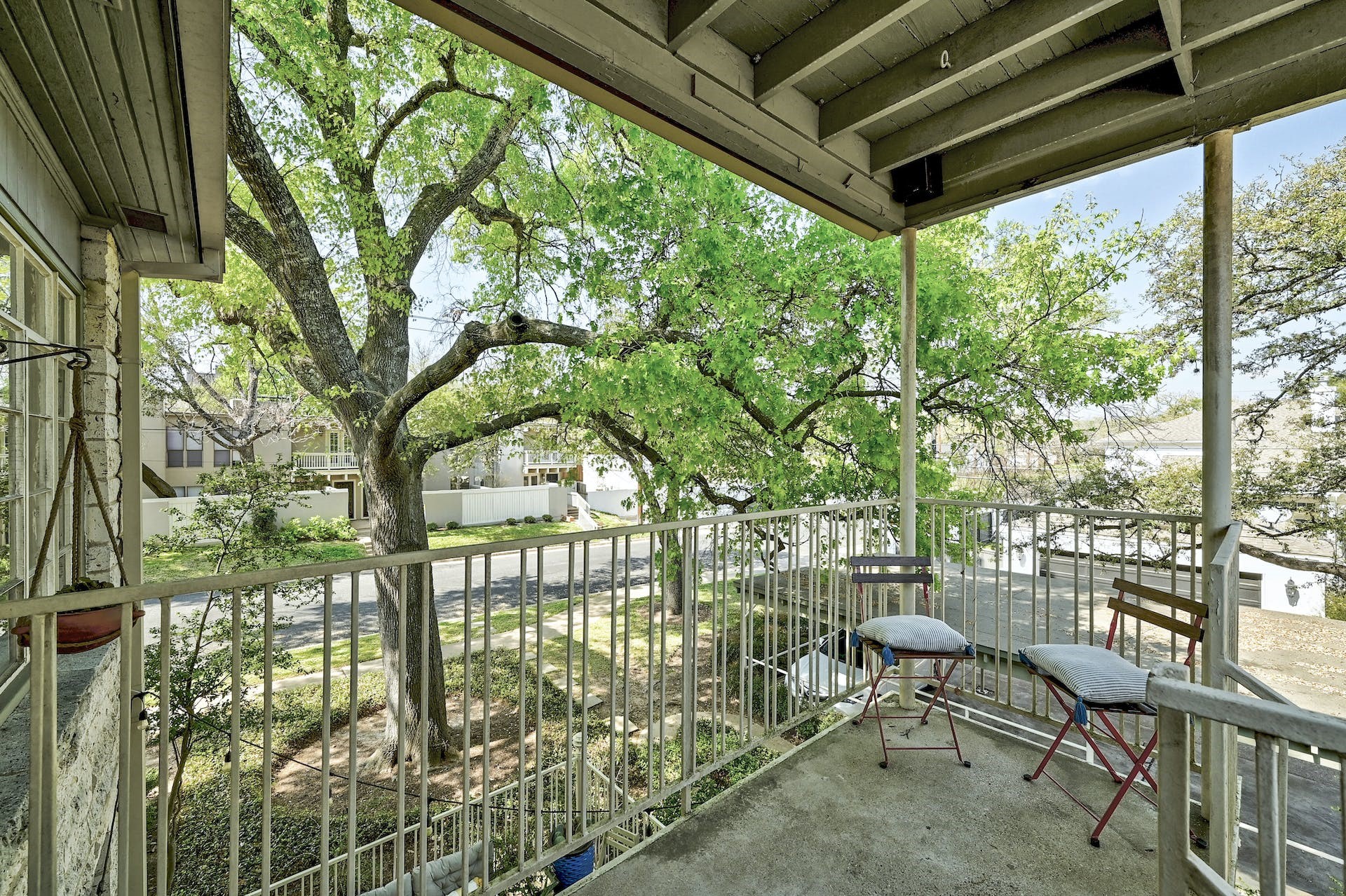3416 Enfield Road, Unit B Austin, TX 78703 - Photo 26 of 31 Covered back porch can fit two chairs.