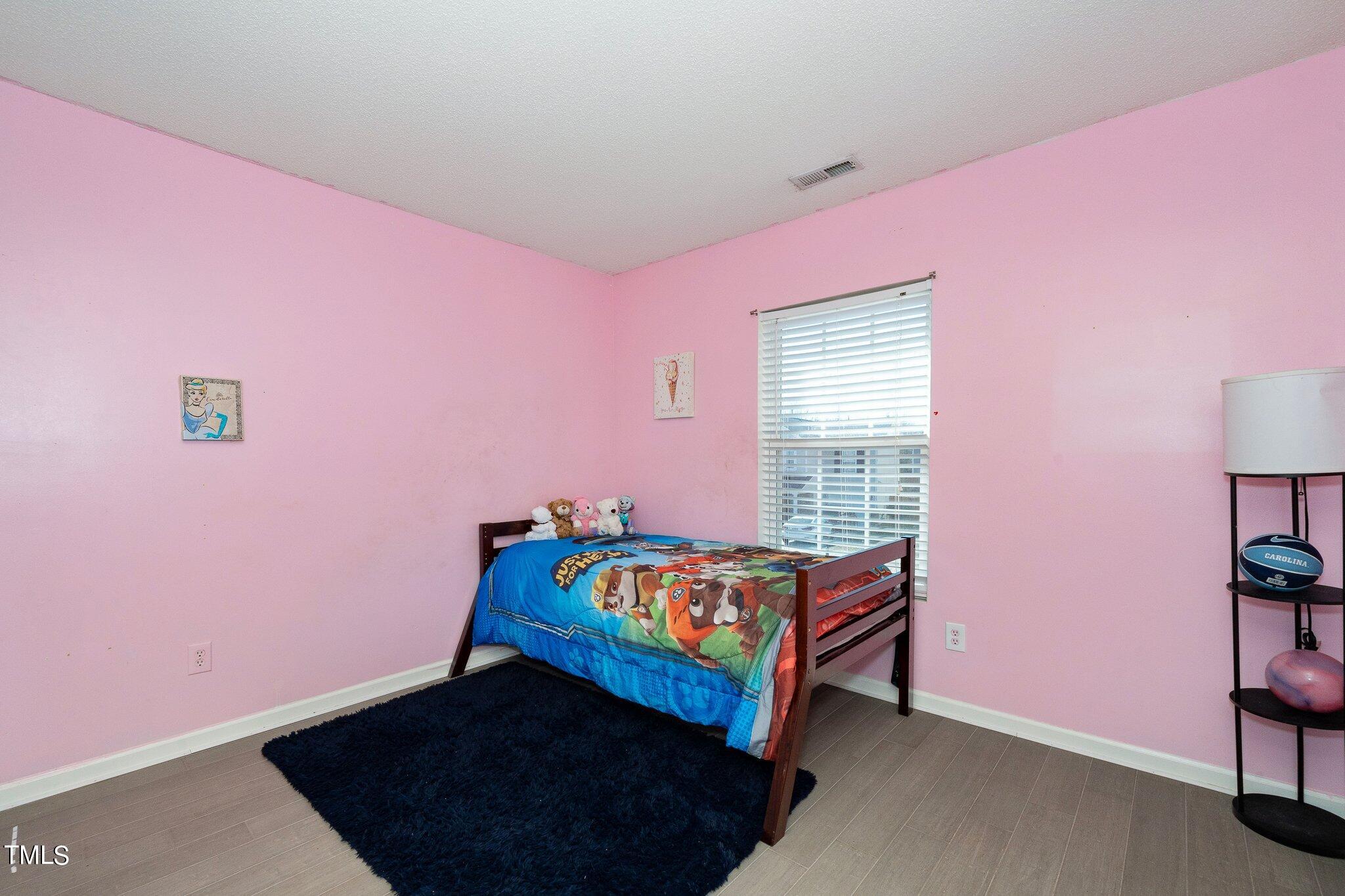 3801 Tryon Ridge Drive Raleigh, NC 27610 - Photo 15 of 23 a bedroom with pink walls and pink rug