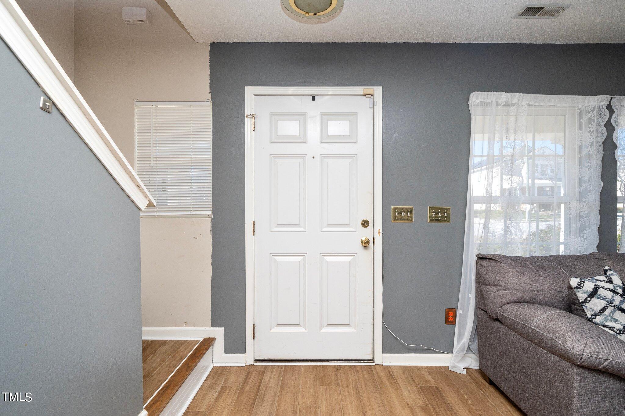 3801 Tryon Ridge Drive Raleigh, NC 27610 - Photo 4 of 23 a living room with furniture and a window