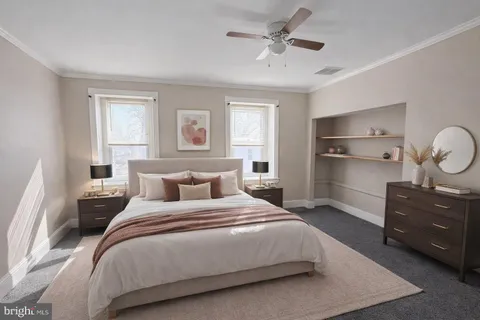 a bedroom with a bed and window
