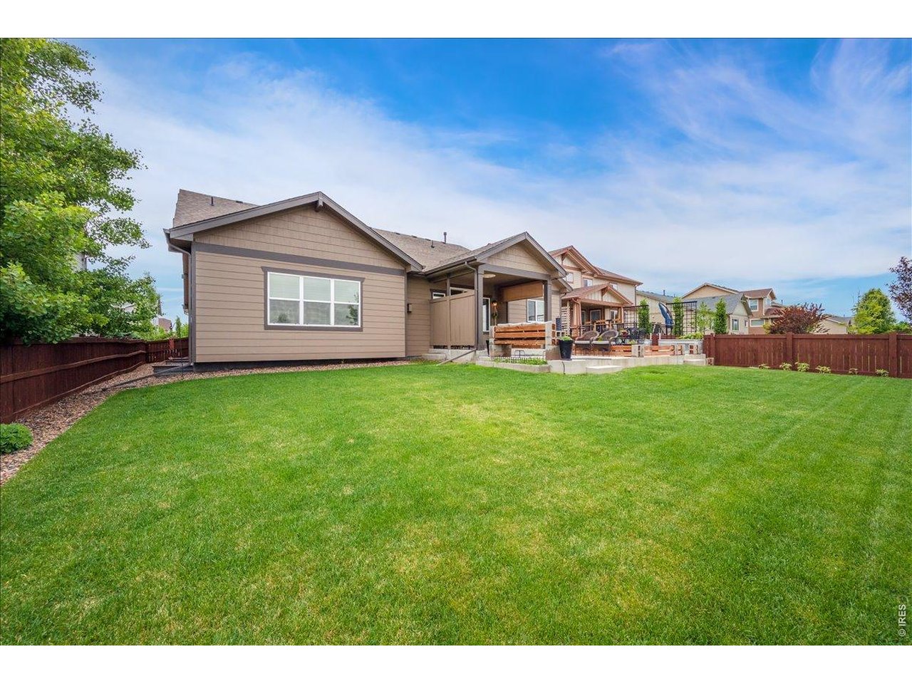 6096 Story Road Timnath, CO 80547 - Photo 43 of 50 a view of a house with a big yard and large trees