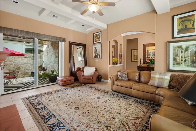 a living room with furniture and a rug