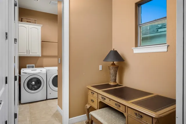 a utility room with dryer and washer