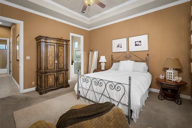 a bedroom with a bed and a television