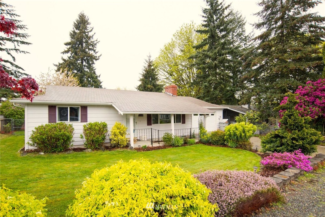 11510 Southeast 178th Place Renton, WA 98055 - Photo 1 of 18 a front view of a house with garden