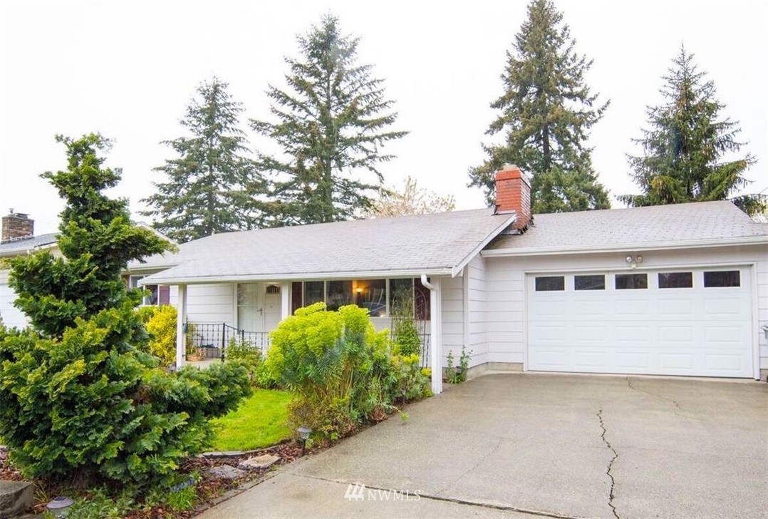 11510 Southeast 178th Place Renton, WA 98055 - Photo 2 of 18 a view of a house with a yard plants and large tree