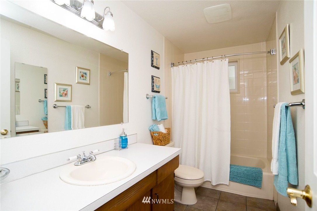 11510 Southeast 178th Place Renton, WA 98055 - Photo 13 of 18 a bathroom with a sink toilet and shower