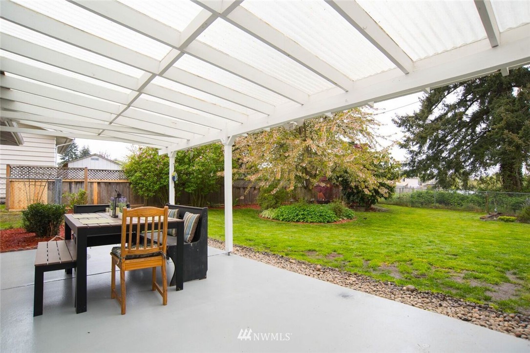 11510 Southeast 178th Place Renton, WA 98055 - Photo 14 of 18 a roof deck with table and chairs and potted plants