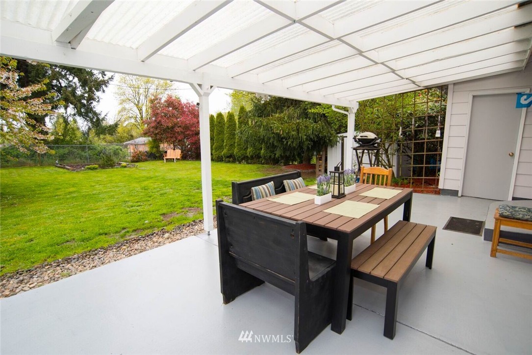 11510 Southeast 178th Place Renton, WA 98055 - Photo 15 of 18 a view of a patio with a table chairs and a backyard
