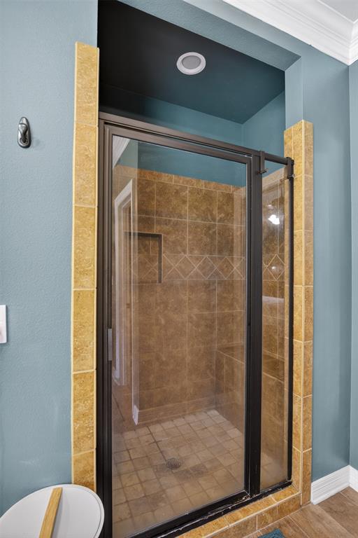 11868 Timber Ridge Drive Keithville, LA 71047 - Photo 17 of 37 Enclosed shower with clear glass door, black trim, and a tile surround