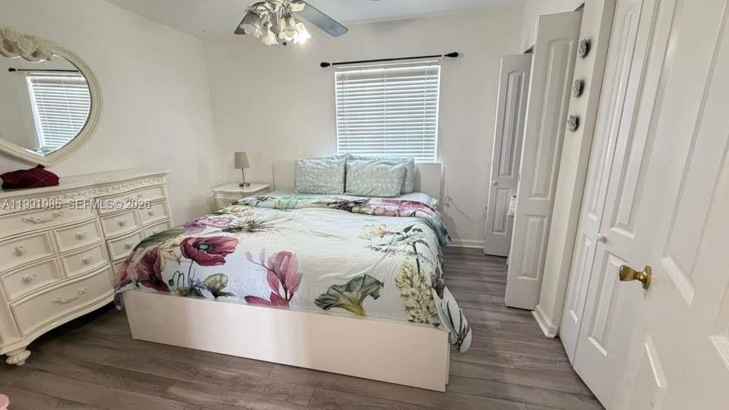 14065 Southwest 278th Street Homestead, FL 33032 - Photo 16 of 30 a bedroom with a bed and a mirror