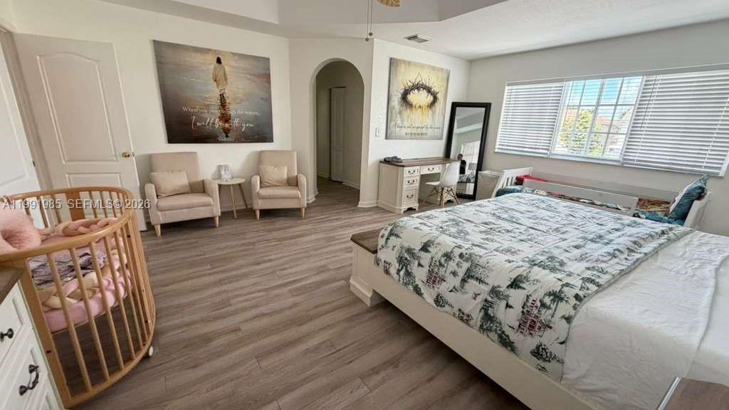 14065 Southwest 278th Street Homestead, FL 33032 - Photo 18 of 30 a bedroom with a bed a couch and dresser