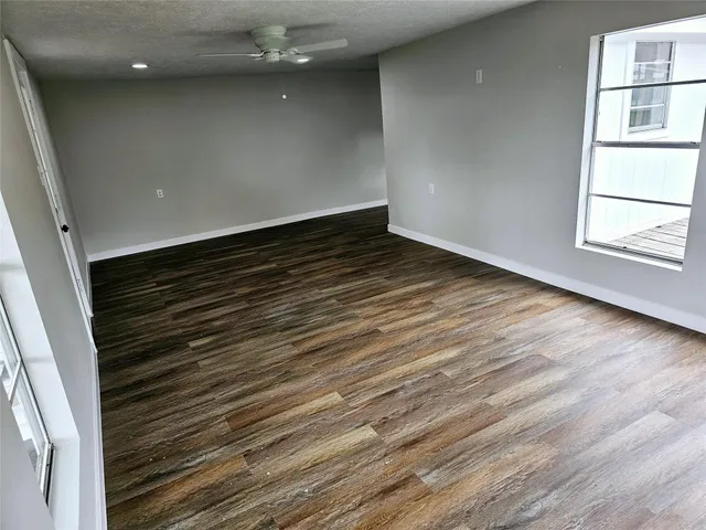 a large kitchen with stainless steel appliances granite countertop a stove a sink and a refrigerator