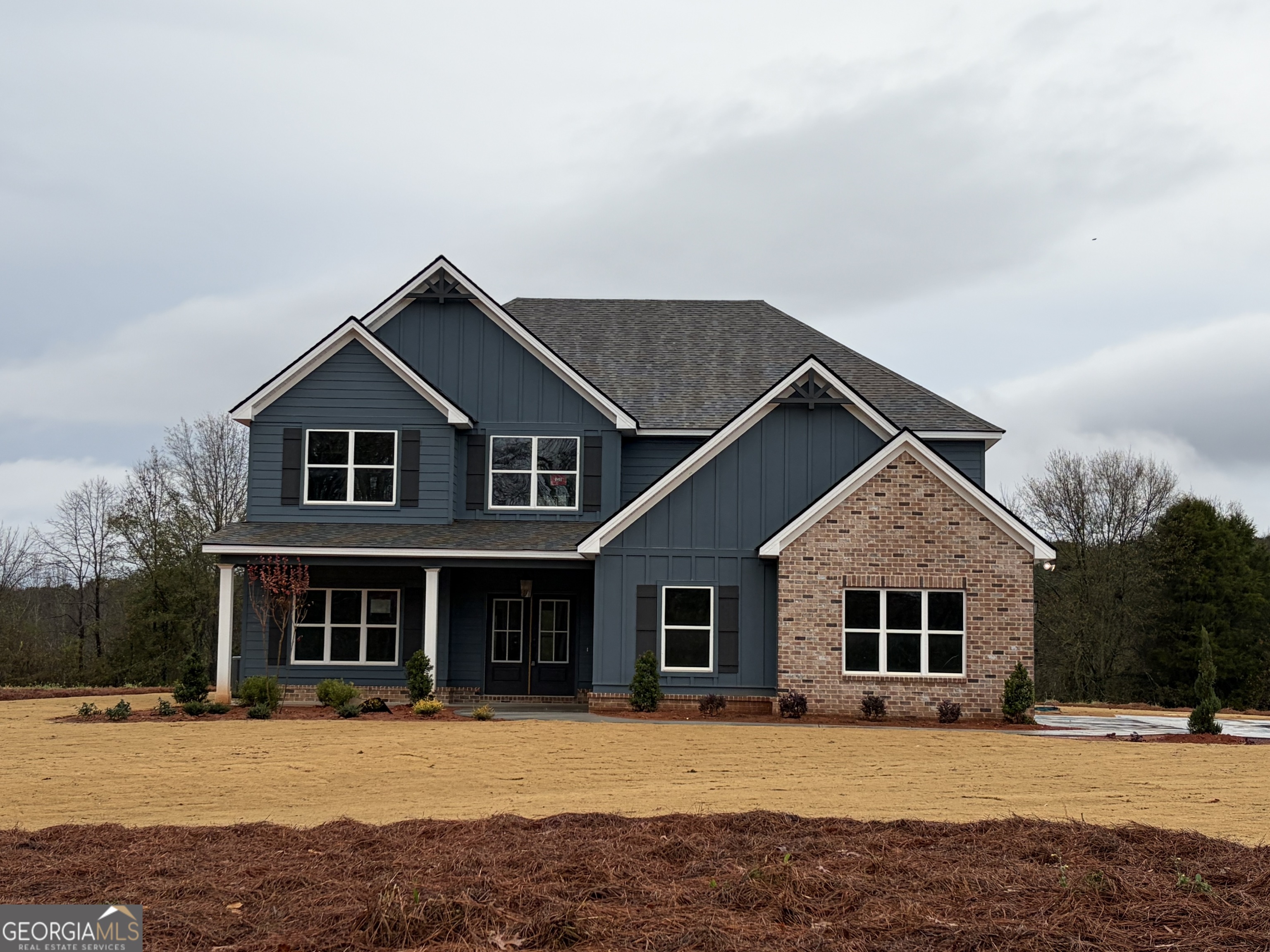 a front view of a house with yard
