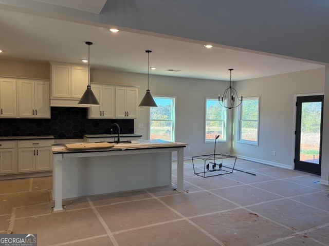 3083 W Highway Bowdon, GA 30108 - Photo 14 of 14 a large kitchen with kitchen island a sink stainless steel appliances and cabinets
