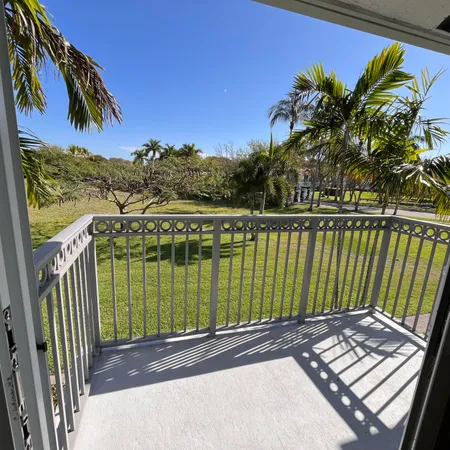 a view of a balcony with lake view and a ocean view