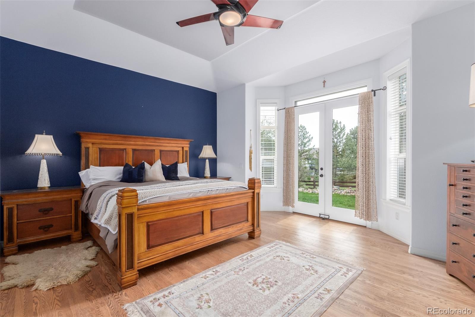 21923 East Ridge Trail Circle Aurora, CO 80016 - Photo 20 of 40 a bed sitting in a spacious bedroom next to a window
