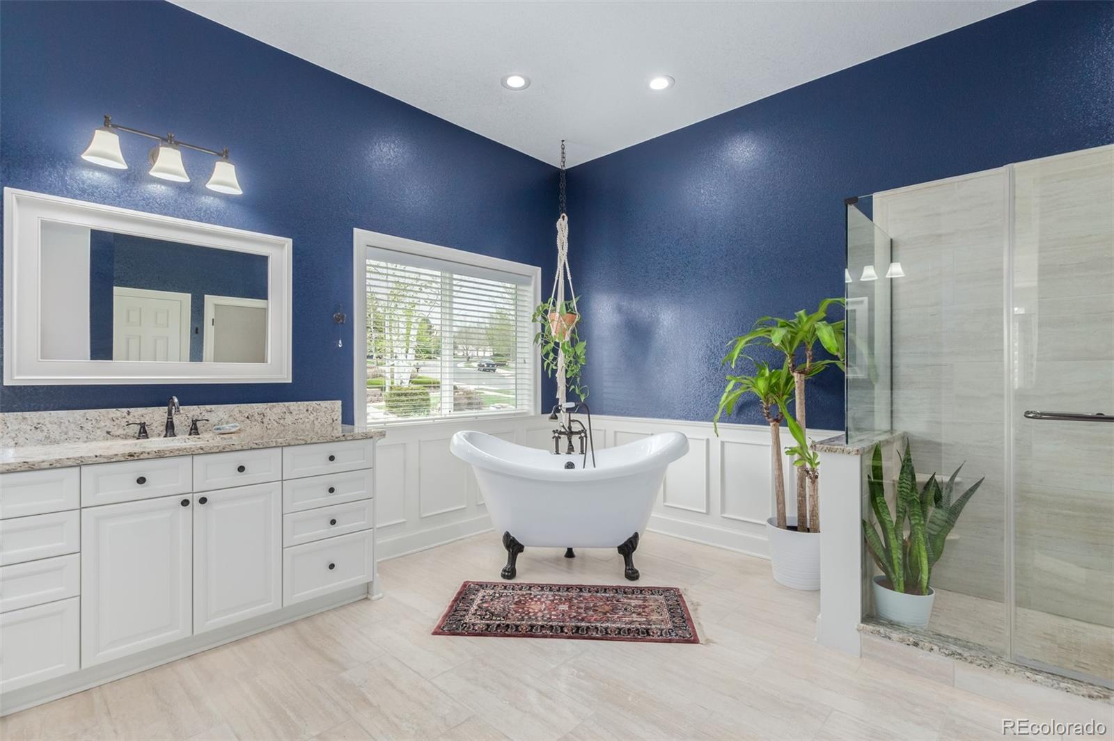 21923 East Ridge Trail Circle Aurora, CO 80016 - Photo 22 of 40 a bathroom with a sink and mirror