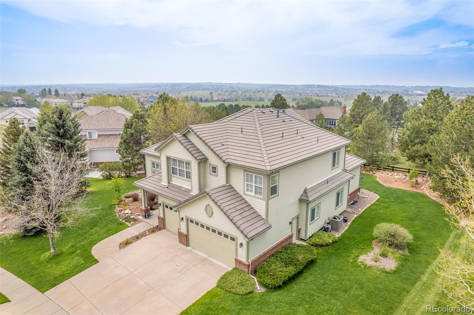 21923 East Ridge Trail Circle Aurora, CO 80016 - Photo 31 of 40 an aerial view of a house with a garden and plants