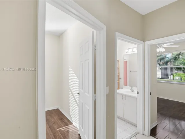 a view of a bathroom with wooden floor