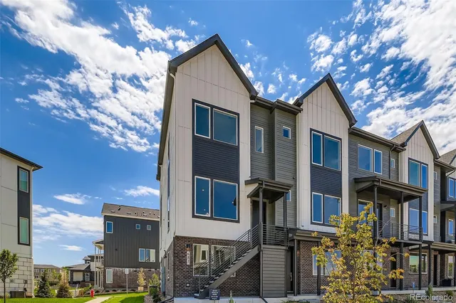 a view of a house with a tree