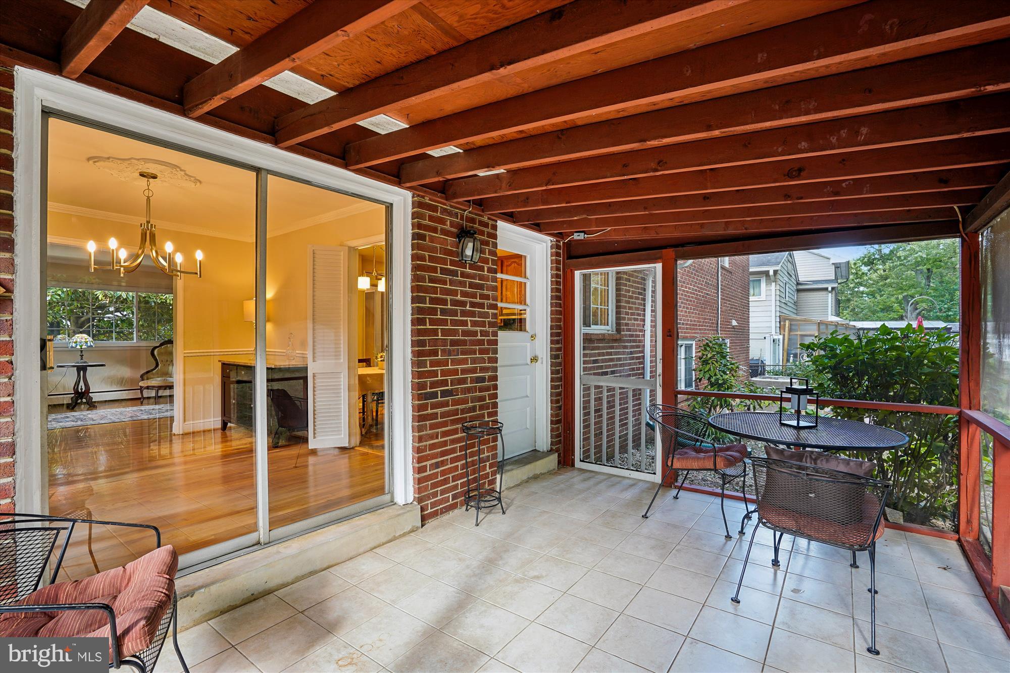 6216 Rockhurst Road Bethesda, MD 20817 - Photo 14 of 52 a outdoor space with lots of furniture and glass windows