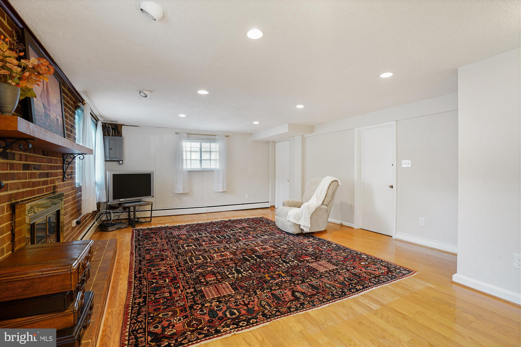 6216 Rockhurst Road Bethesda, MD 20817 - Photo 23 of 52 a living room with furniture rug and fireplace