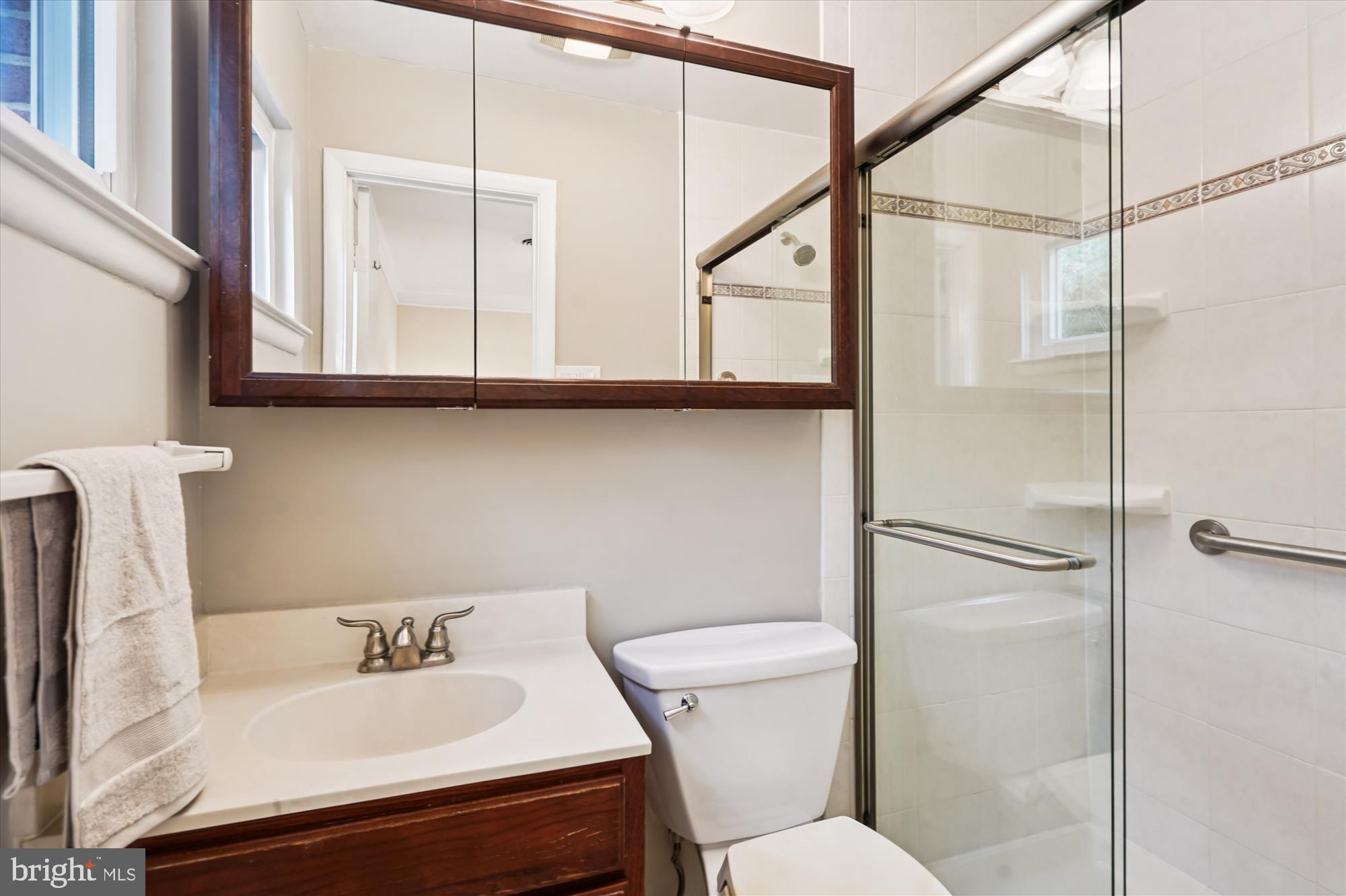 6216 Rockhurst Road Bethesda, MD 20817 - Photo 27 of 52 a bathroom with a sink toilet and shower
