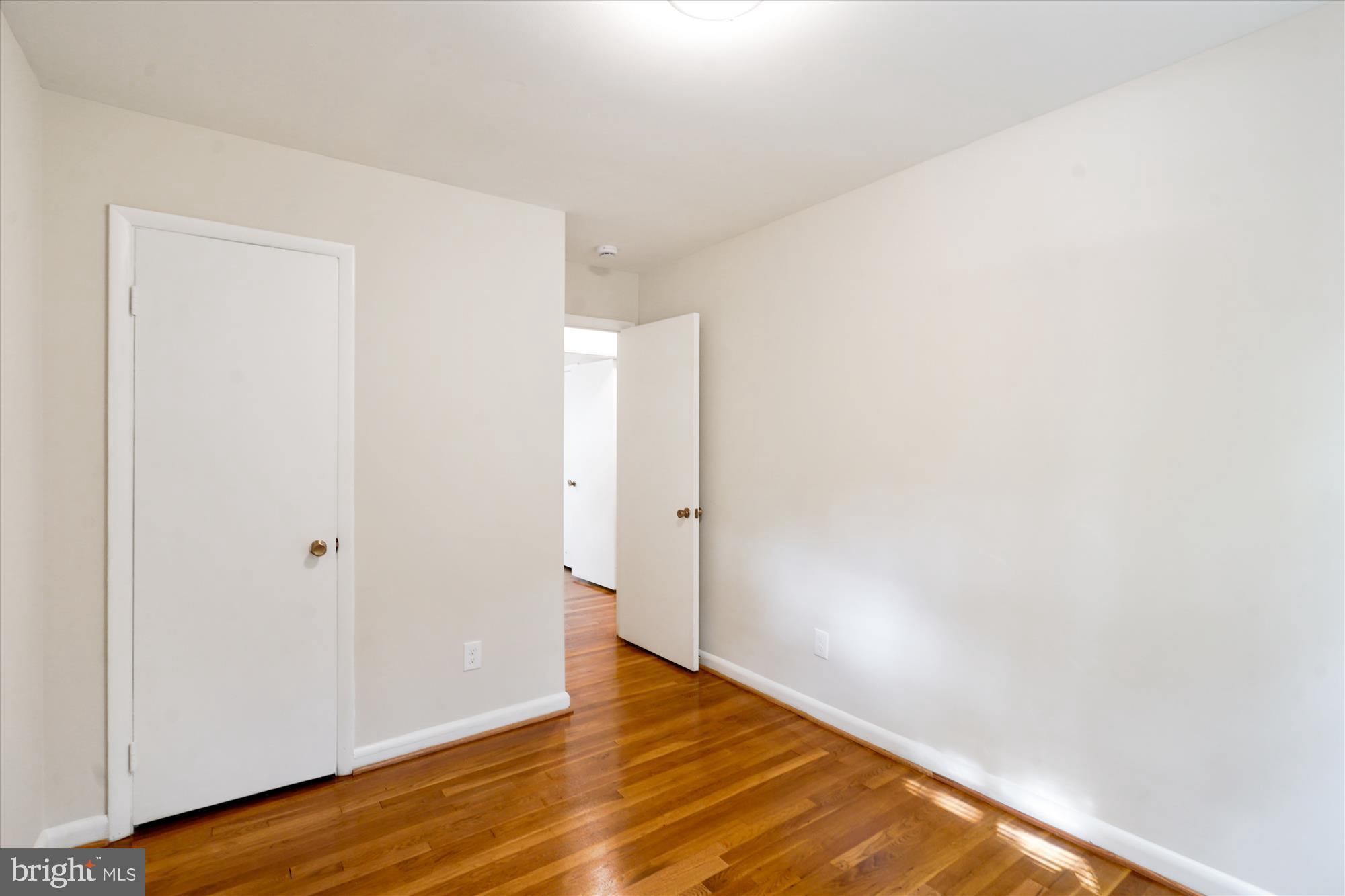 6216 Rockhurst Road Bethesda, MD 20817 - Photo 36 of 52 a view of an empty room with wooden floor