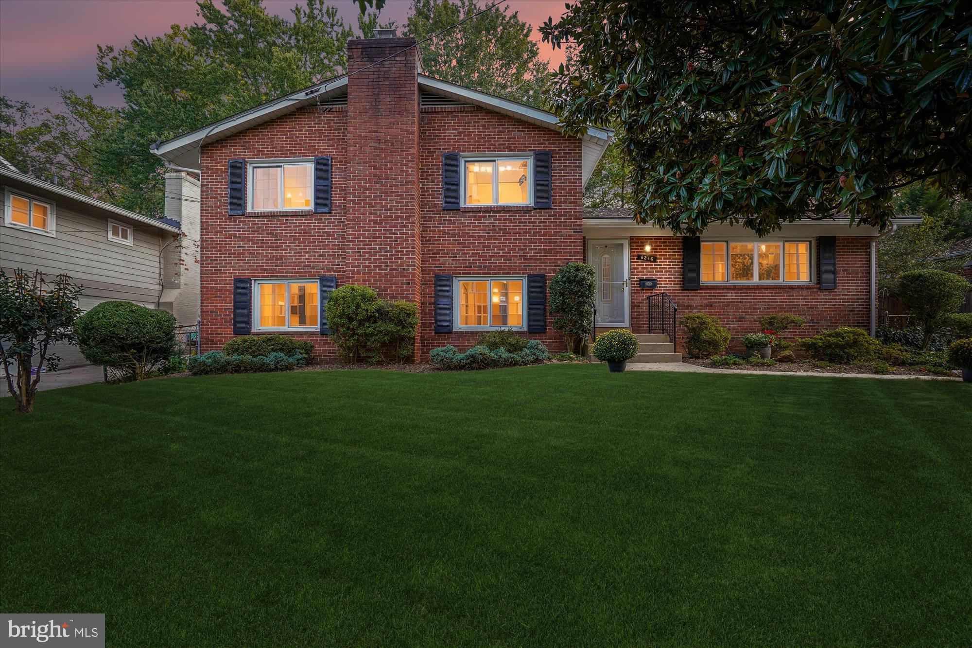 6216 Rockhurst Road Bethesda, MD 20817 - Photo 6 of 52 a front view of a house with garden