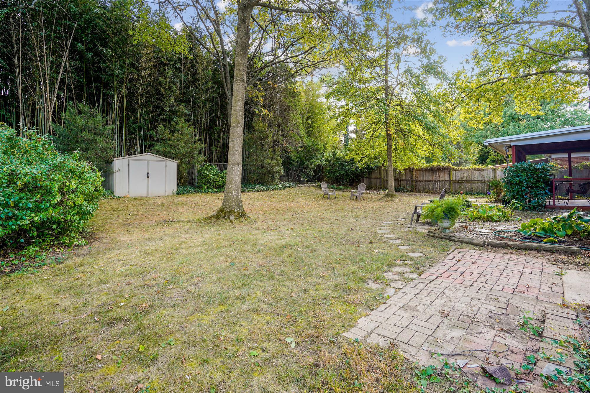 6216 Rockhurst Road Bethesda, MD 20817 - Photo 8 of 52 a backyard of a house with lots of green space