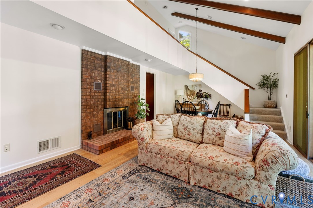 281 Echo Meadows Road Rockville, VA 23146 - Photo 11 of 49 a living room with furniture wooden floor and a rug