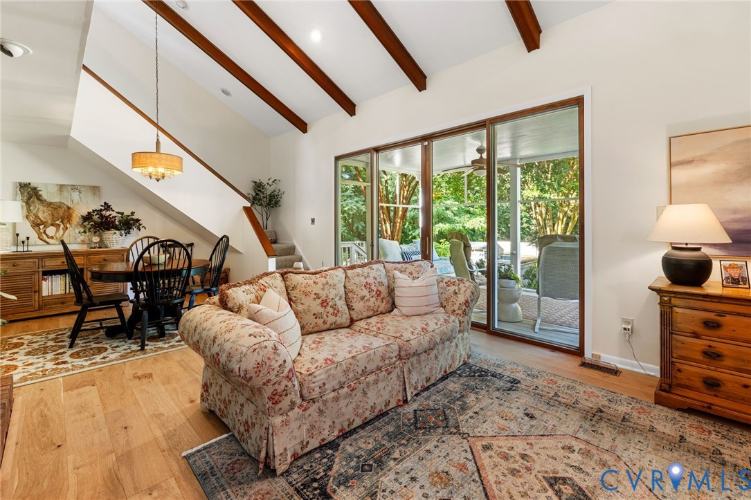 281 Echo Meadows Road Rockville, VA 23146 - Photo 14 of 49 a living room with furniture and a floor to ceiling window