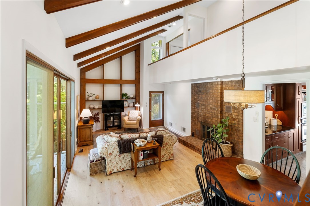 281 Echo Meadows Road Rockville, VA 23146 - Photo 15 of 49 a living room with furniture dining table and wooden floor