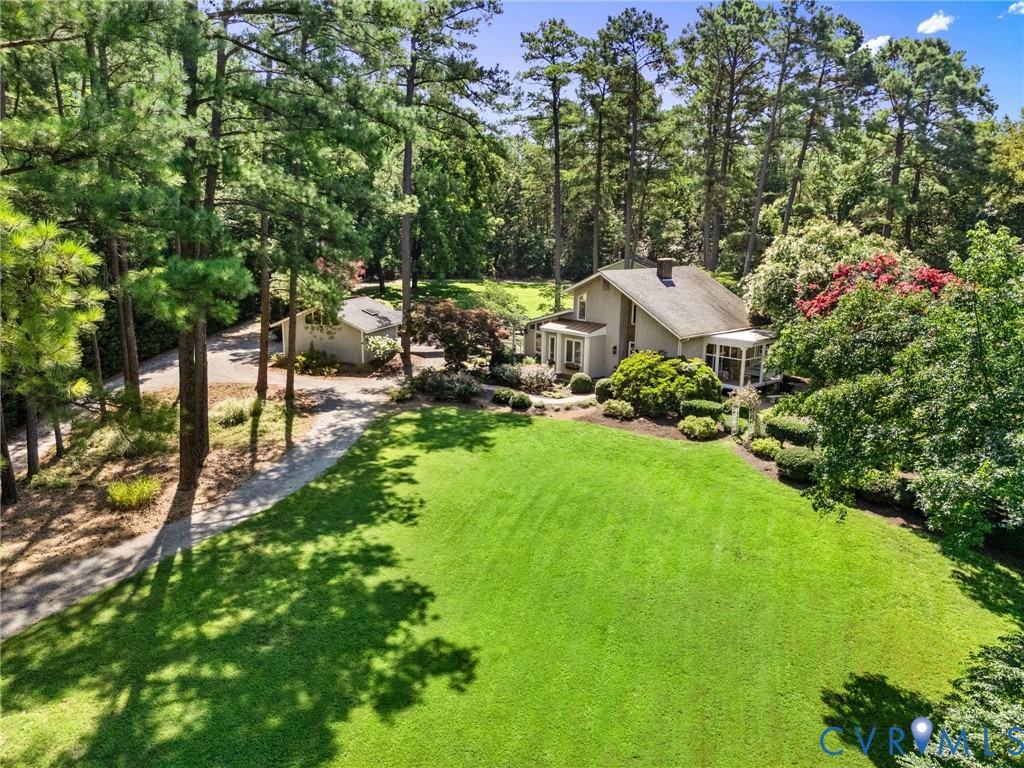 281 Echo Meadows Road Rockville, VA 23146 - Photo 2 of 49 a view of backyard with table and chairs and potted plants
