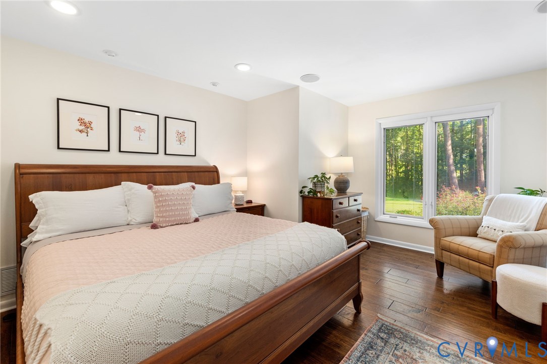 281 Echo Meadows Road Rockville, VA 23146 - Photo 22 of 49 a bedroom with a large bed and a couch