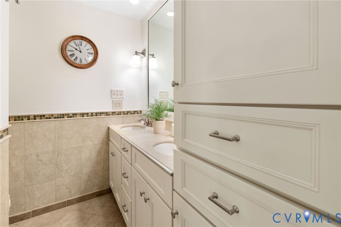 281 Echo Meadows Road Rockville, VA 23146 - Photo 23 of 49 a bathroom with a granite countertop sink and a mirror