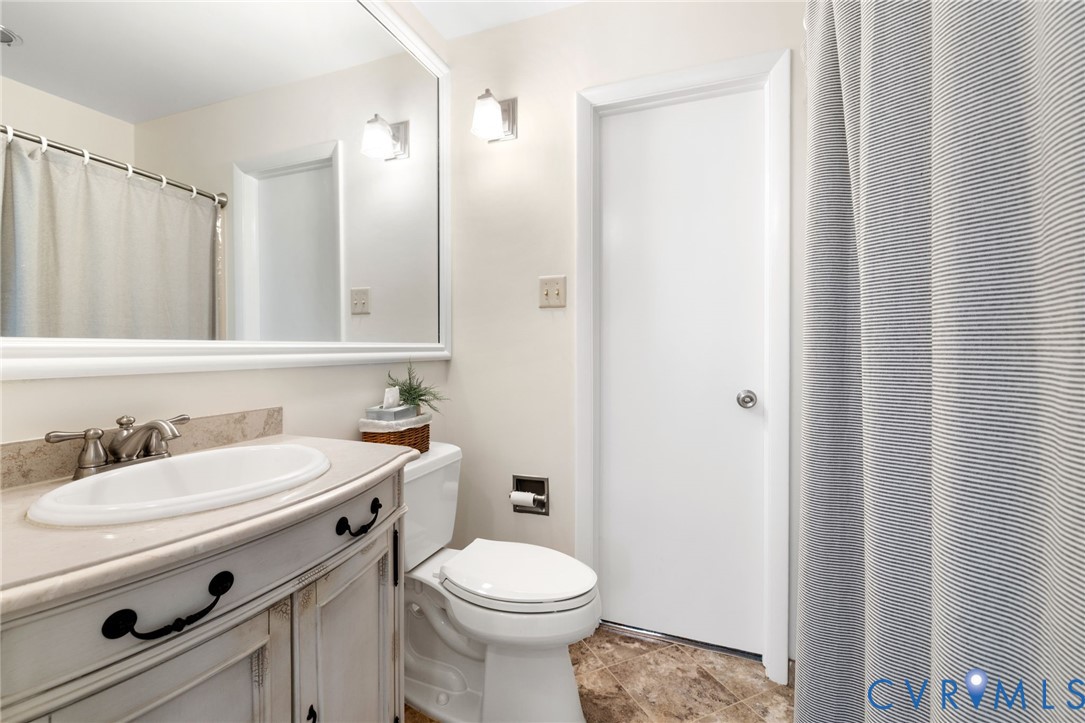 281 Echo Meadows Road Rockville, VA 23146 - Photo 26 of 49 a bathroom with a sink a toilet and a mirror