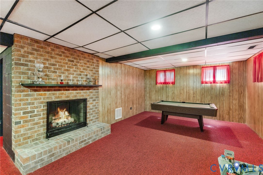 281 Echo Meadows Road Rockville, VA 23146 - Photo 30 of 49 a room with furniture and a fireplace