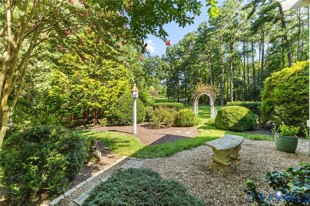 281 Echo Meadows Road Rockville, VA 23146 - Photo 34 of 49 a view of a garden with plants and large trees