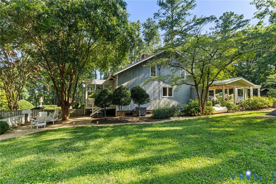 281 Echo Meadows Road Rockville, VA 23146 - Photo 41 of 49 a front view of a house with garden and sitting area