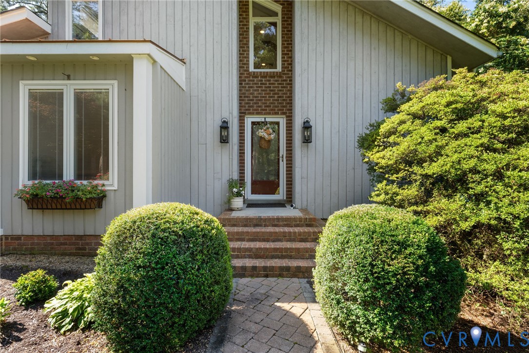 281 Echo Meadows Road Rockville, VA 23146 - Photo 8 of 49 a front view of a house with garden