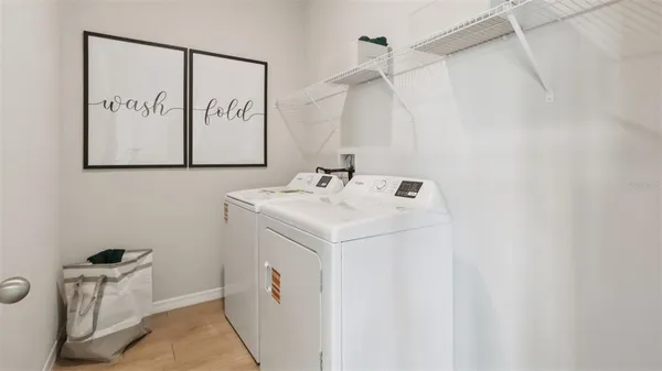 a utility room with dryer and washer