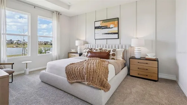 a bedroom with bed and window