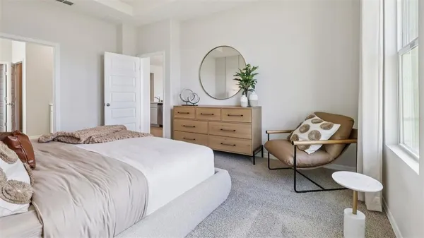 a bedroom with a bed and a mirror