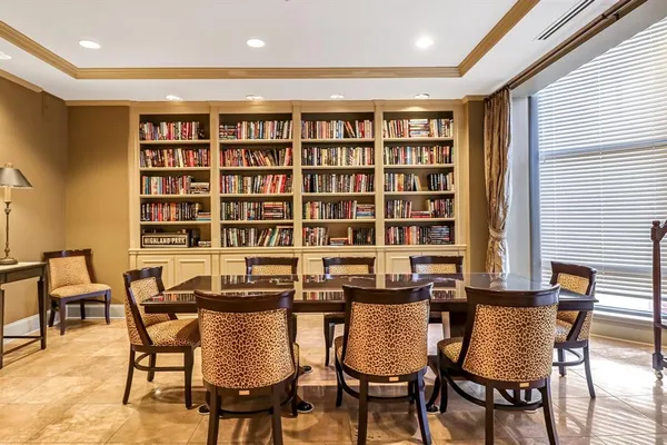 a view of a dining room with furniture and window