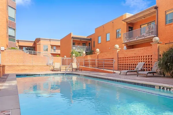 a view of pool with outdoor seating