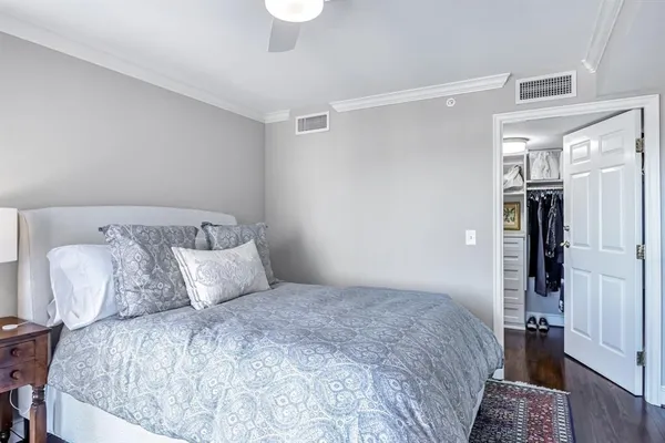 a bedroom with a bed and a walk in closet