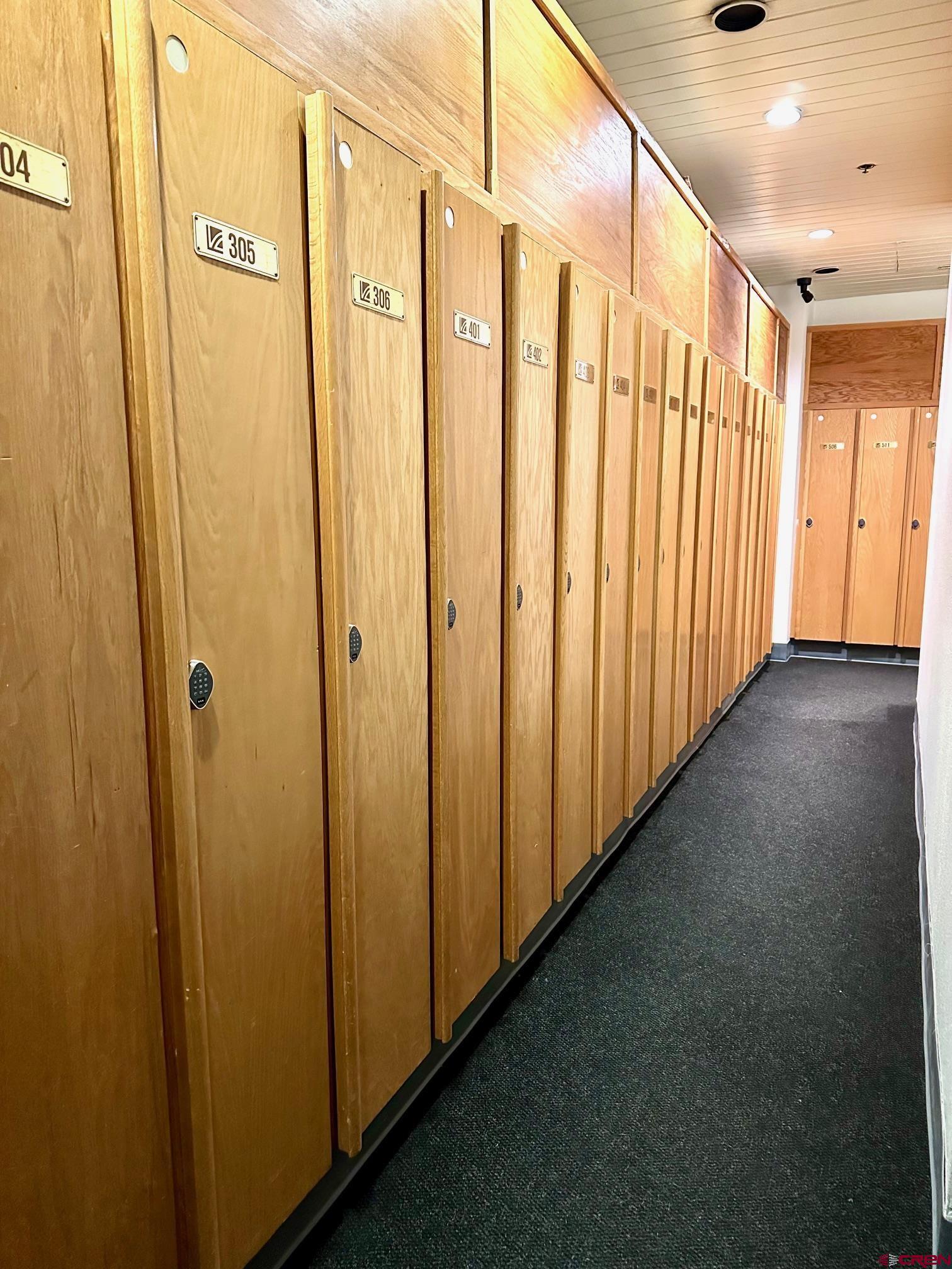 93 Needles Way, Unit 413 Durango, CO 81301 - Photo 31 of 31 a view of a hallway with wooden walls
