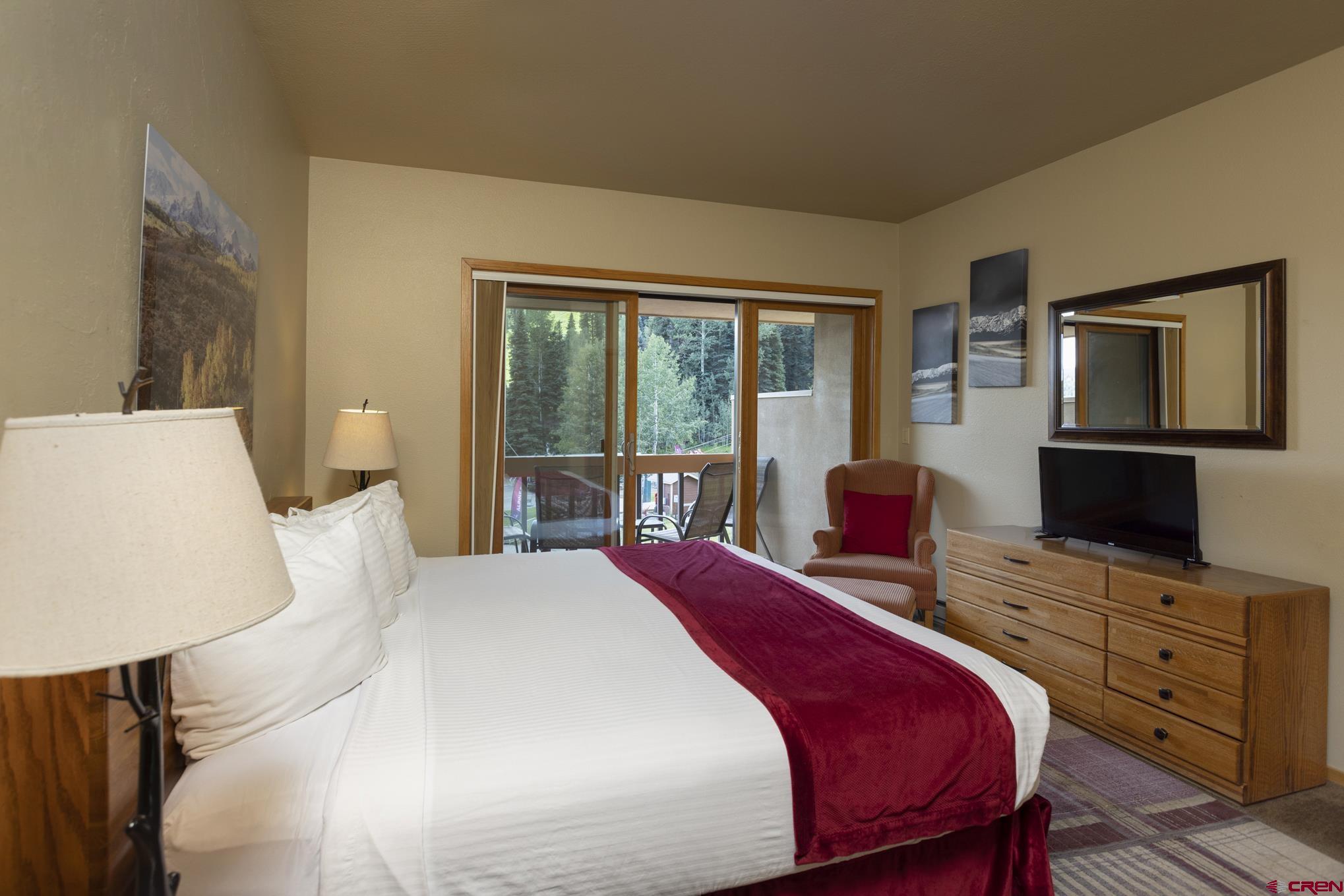 93 Needles Way, Unit 413 Durango, CO 81301 - Photo 8 of 31 a bedroom with a bed and wooden floor